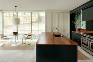 kitchen counter with white cabinets and glass doors