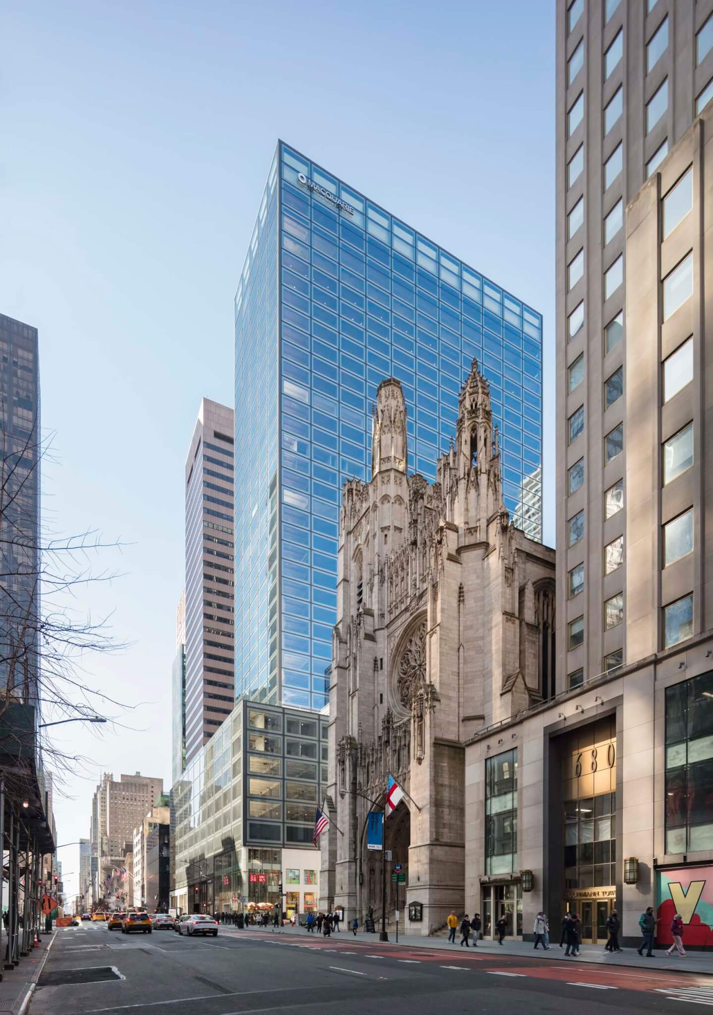 glass building next to historic church