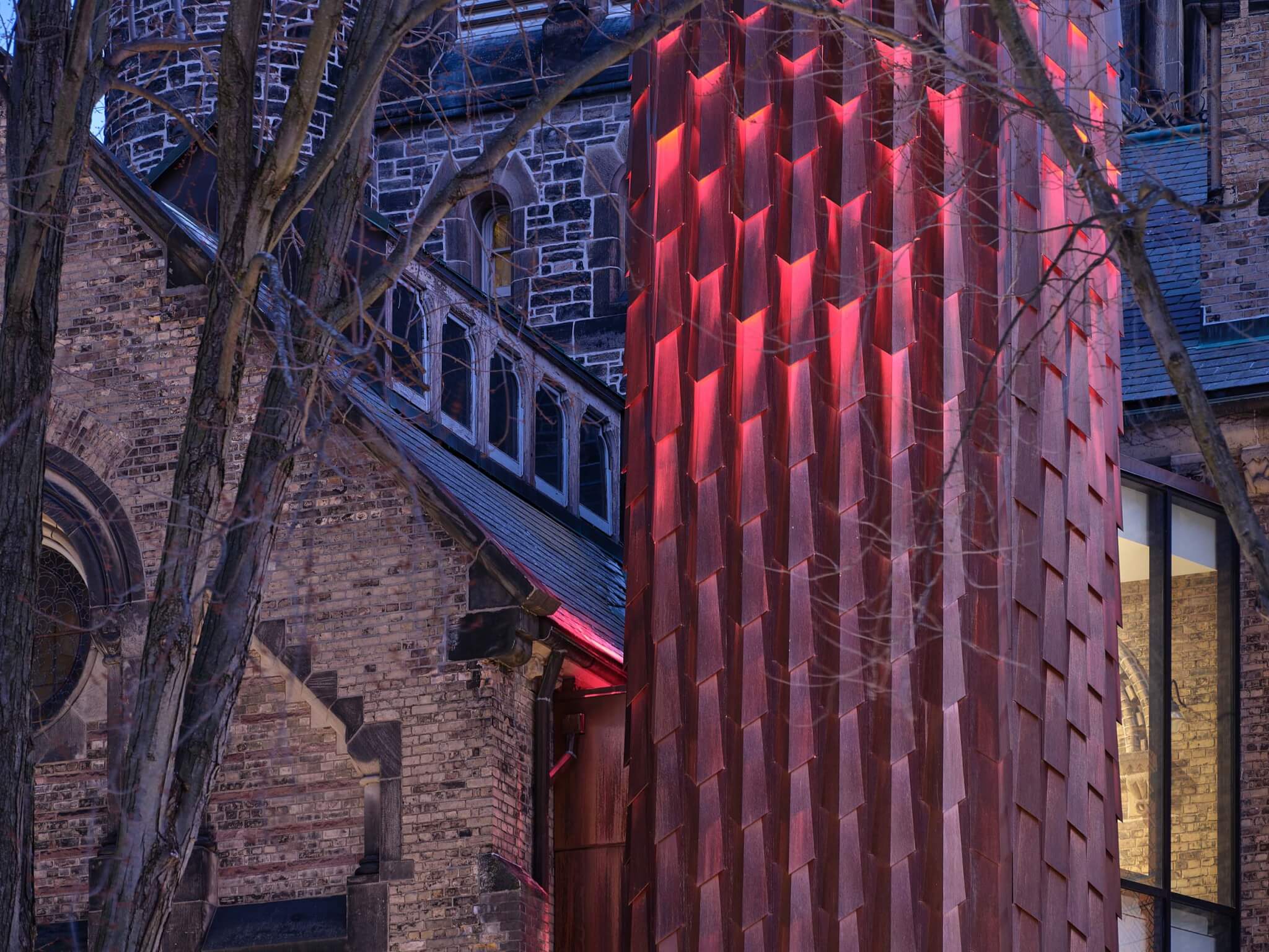 view of copper elevator covering outside University College by Kohn Shnier