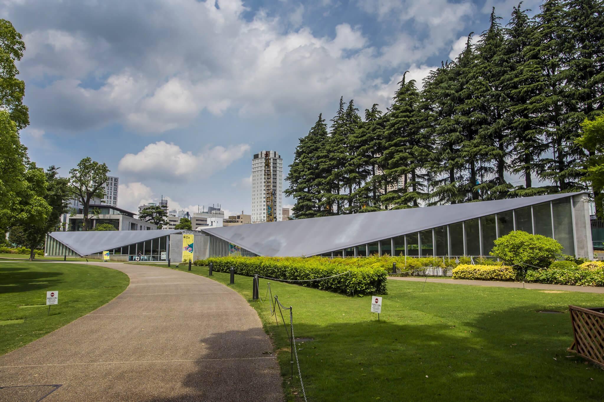 low lying building with angular silver gray roof